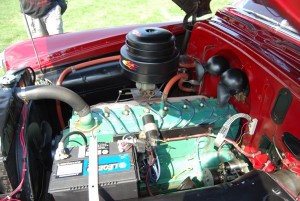 The underhood area of a 1950 Pontiac Eight owned by Chris Wynstra of Franksville, WI, looks pretty much the way other straight eight Pontiacs do, but sometime during its existence this car was converted to propane power.